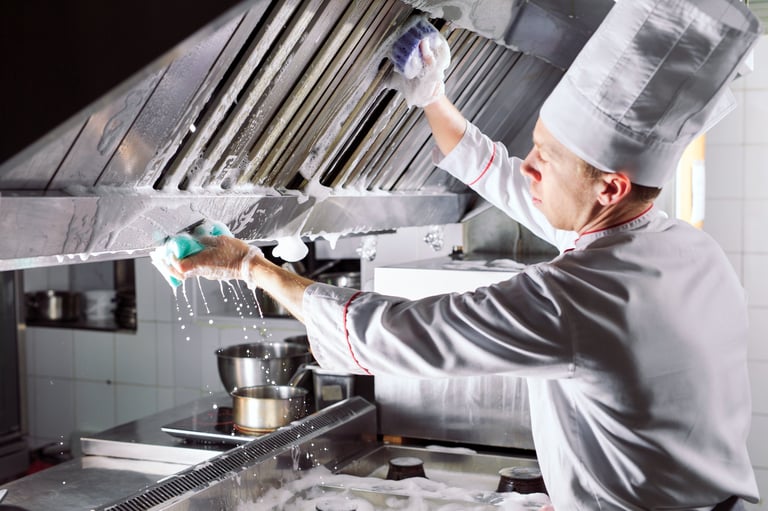 Sanitary day in the restaurant. Repeats wash your workplace. Cooks wash oven, stove and extractor in the Restaurant